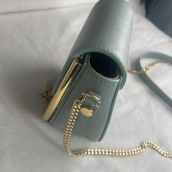 A high-shine bar adds definition to the half-circle silhouette of this elegant. - Picture 6 of 6